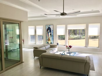 modern living room with shades covering windows