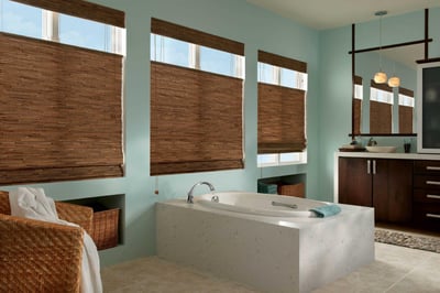 bathroom with woven wood shades